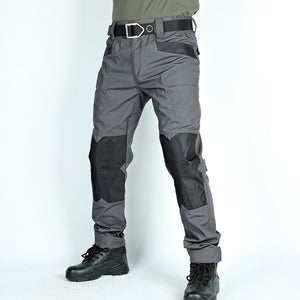 Gray tactical pants with black accents on a white background
