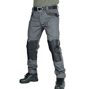 Gray tactical pants with black accents on a white background