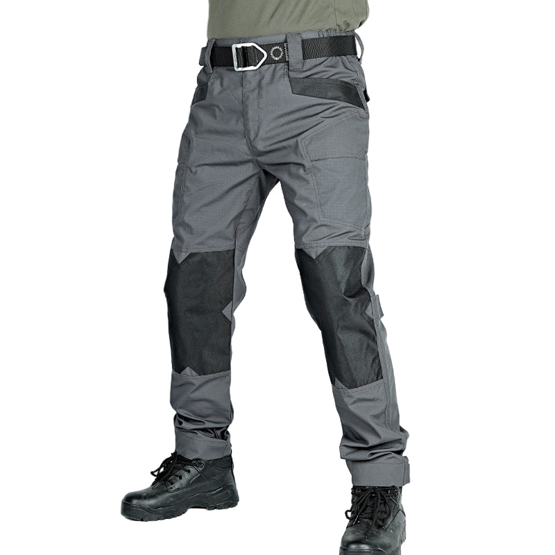 Gray tactical pants with black accents on a white background