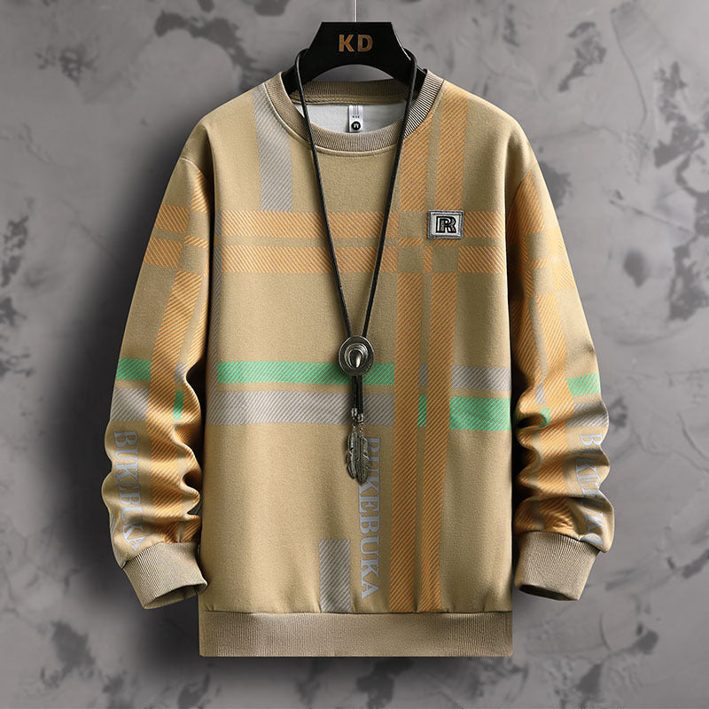 Plaid patterned sweater with brand logos on a textured gray background