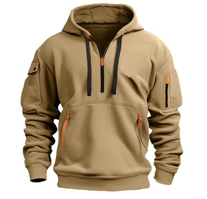Tan hoodie with black zipper and orange accents on a white background