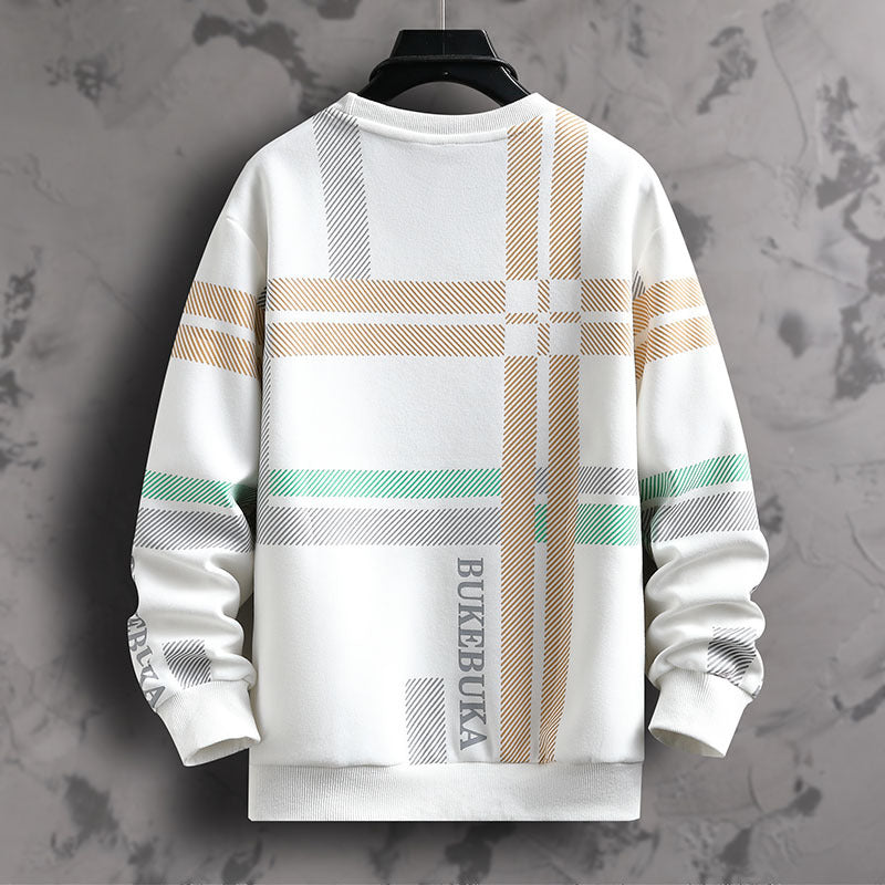 White sweatshirt with plaid patterns and text on a gray textured background