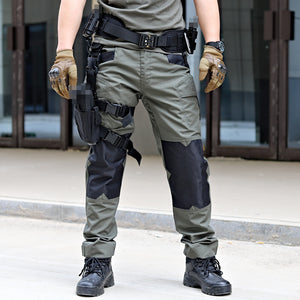 Person wearing tactical gear including pants, boots, and a belt with pouches.
