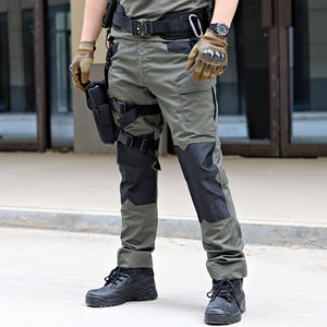 Person wearing tactical gear including pants, boots, and a belt with equipment.