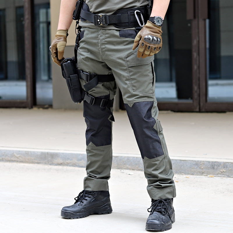 Person wearing tactical gear including pants, boots, and a belt with equipment.